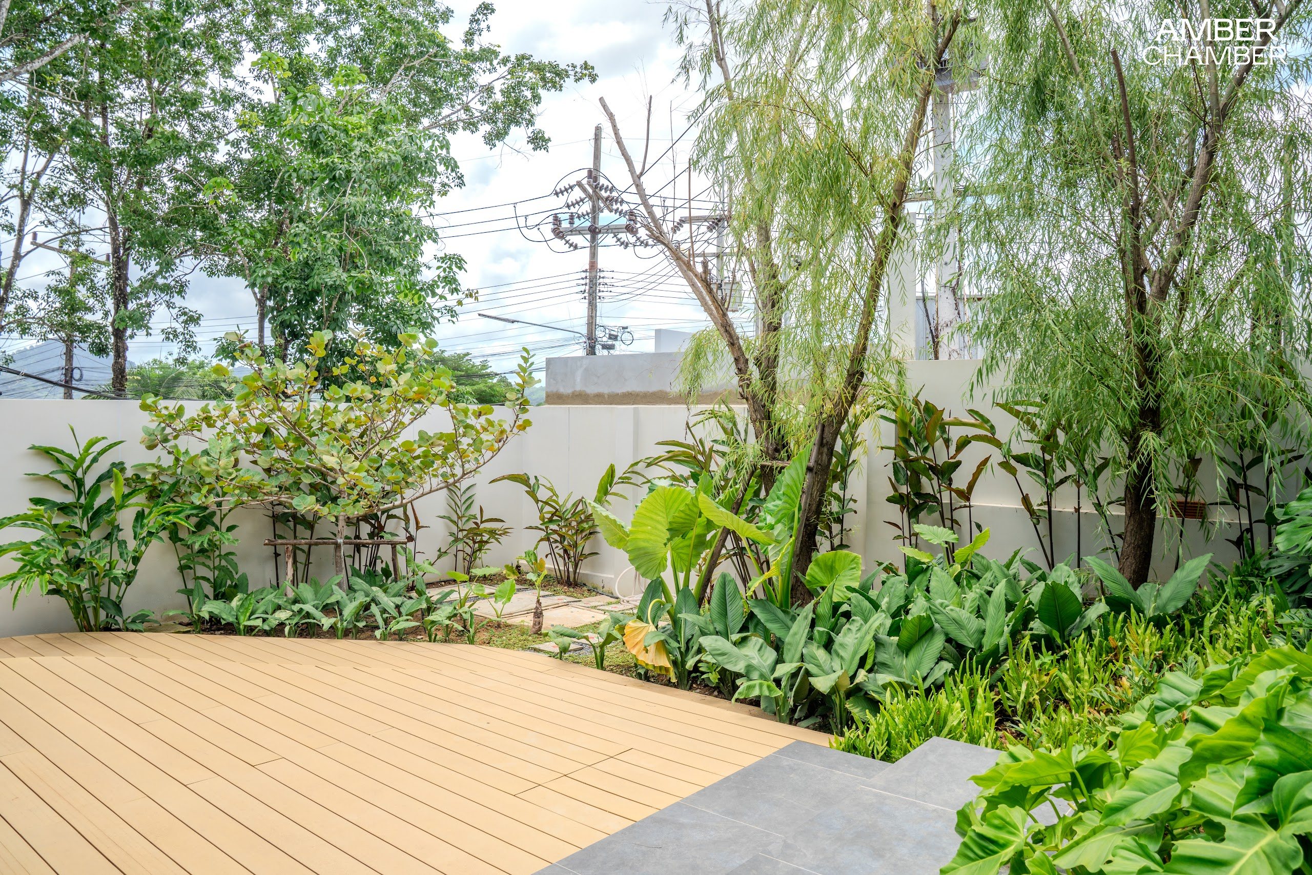 Outdoor living terrace beside the private pool of an Amber Chamber villa