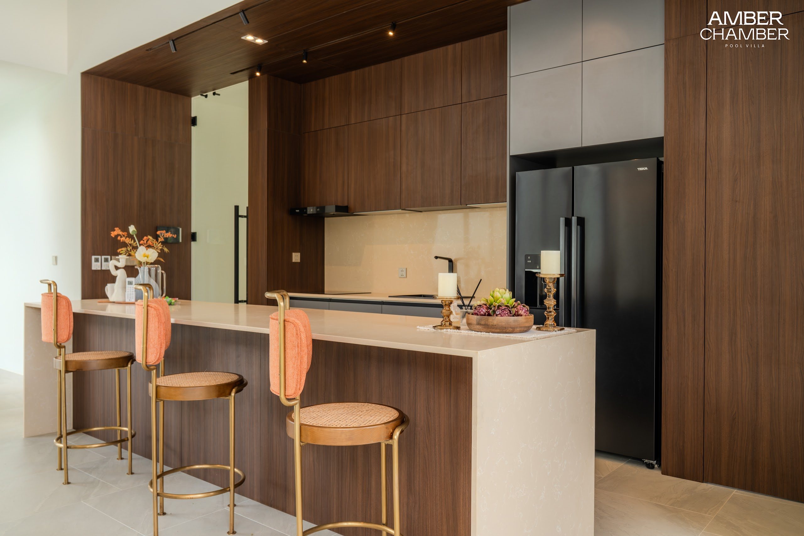 Amber Chamber villa kitchen with island seating and integrated appliances