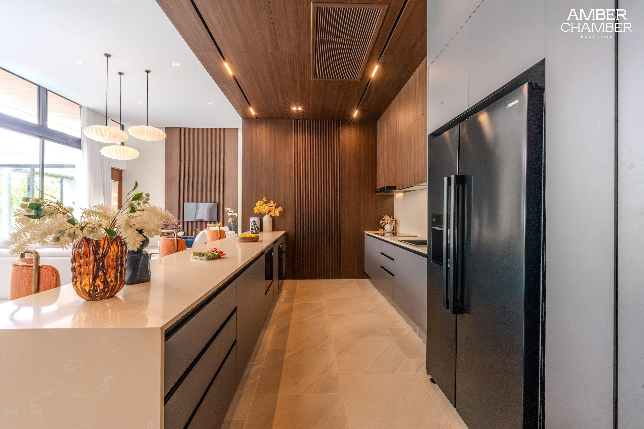 Amber Chamber villa kitchen with island seating and integrated appliances