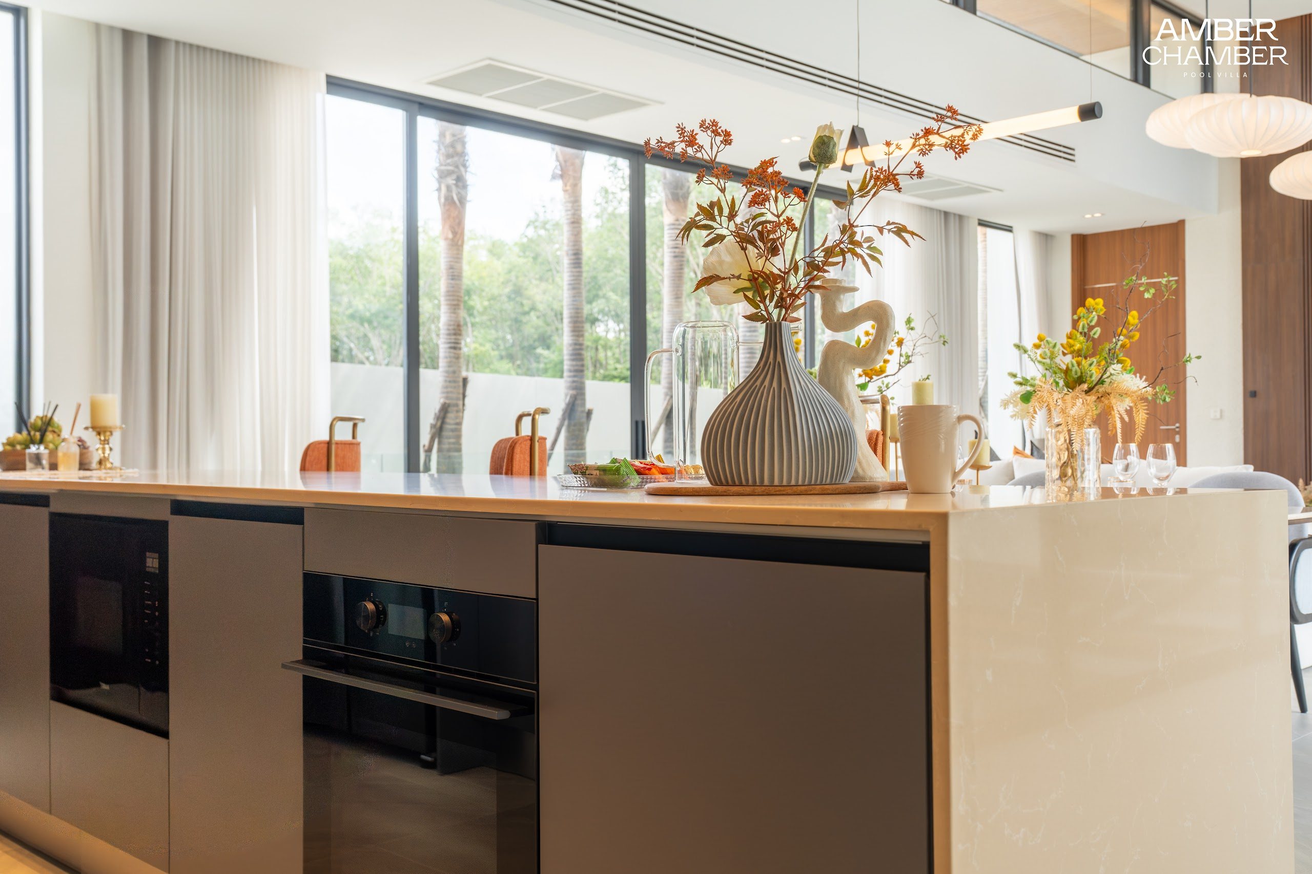 Amber Chamber villa kitchen with island seating and integrated appliances