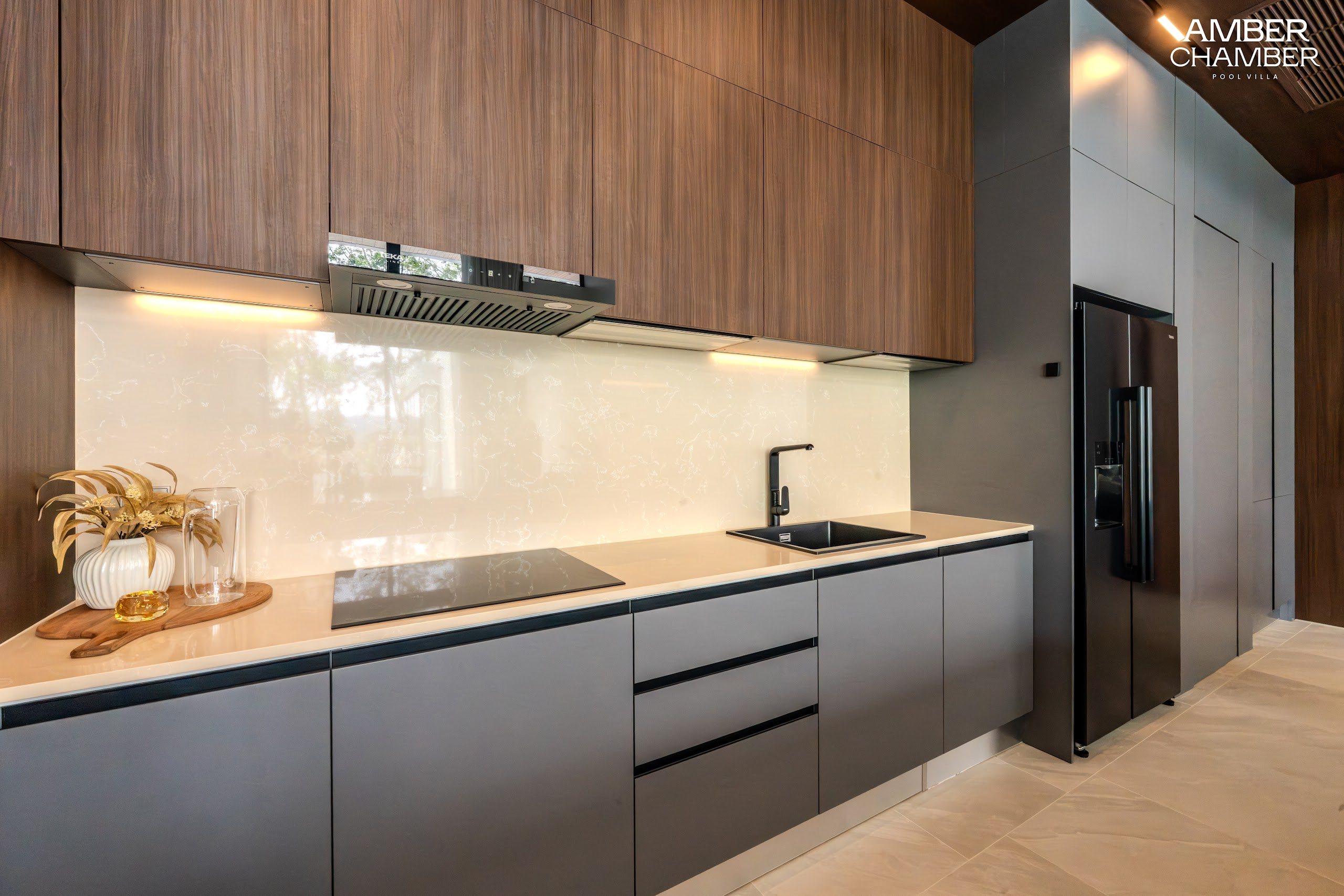 Amber Chamber villa kitchen with island seating and integrated appliances