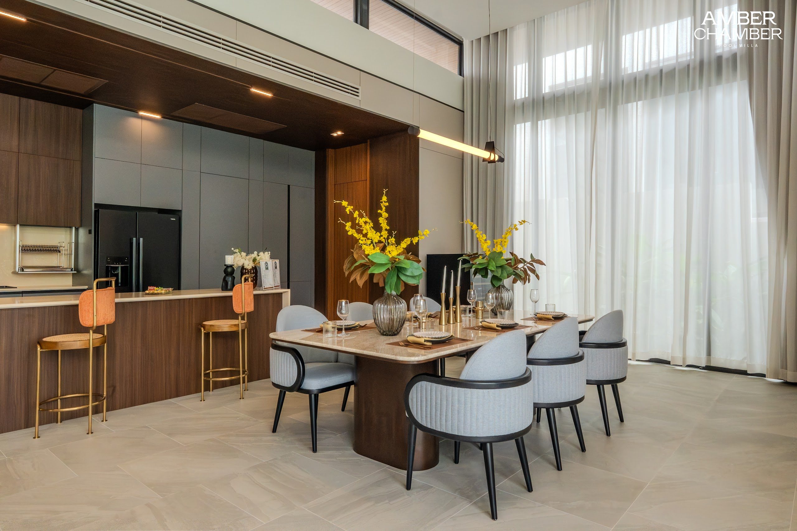 Amber Chamber villa kitchen with island seating and integrated appliances