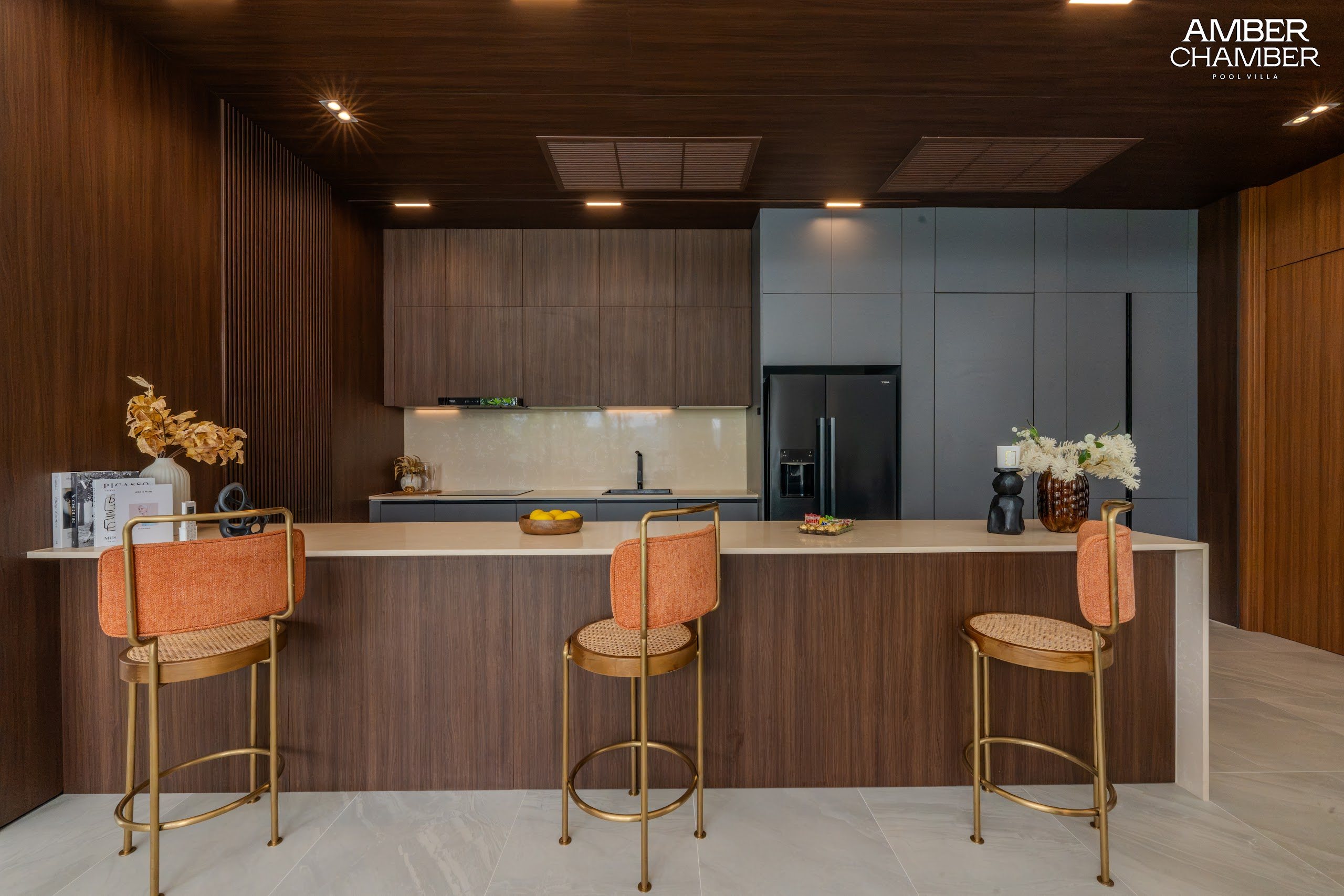 Amber Chamber villa kitchen with island seating and integrated appliances