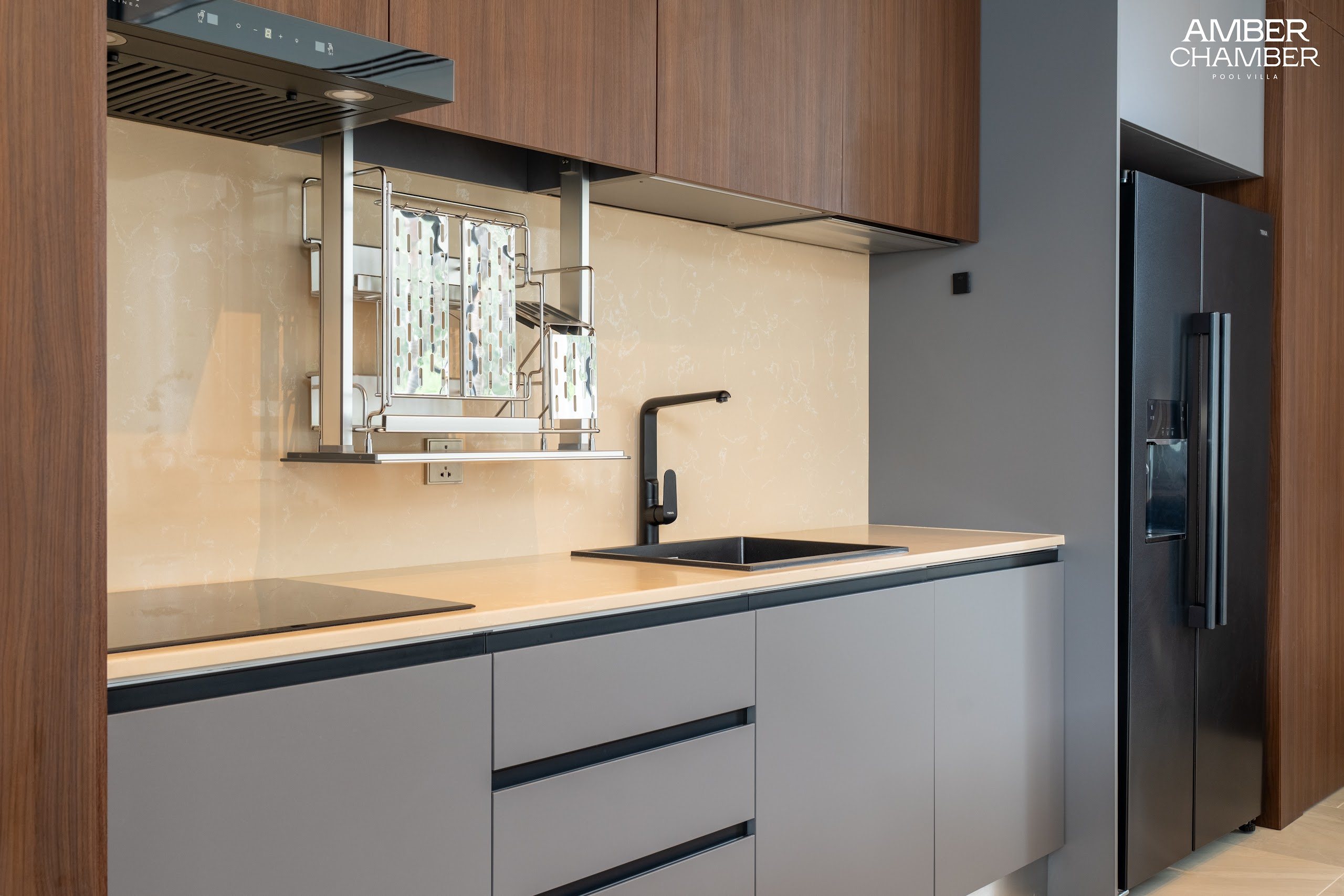 Amber Chamber villa kitchen with island seating and integrated appliances