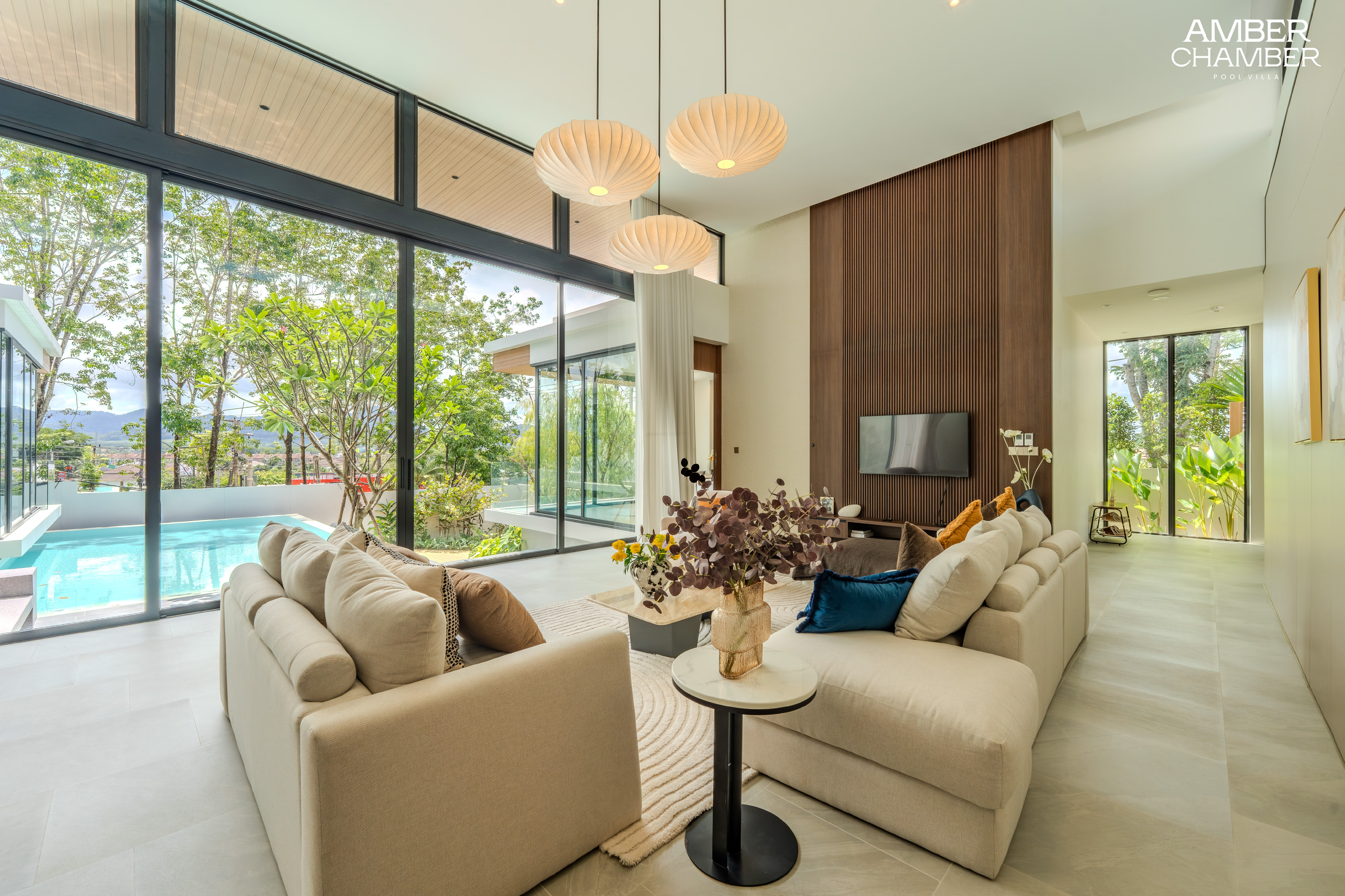 Furnished lounge opening onto the private pool and garden