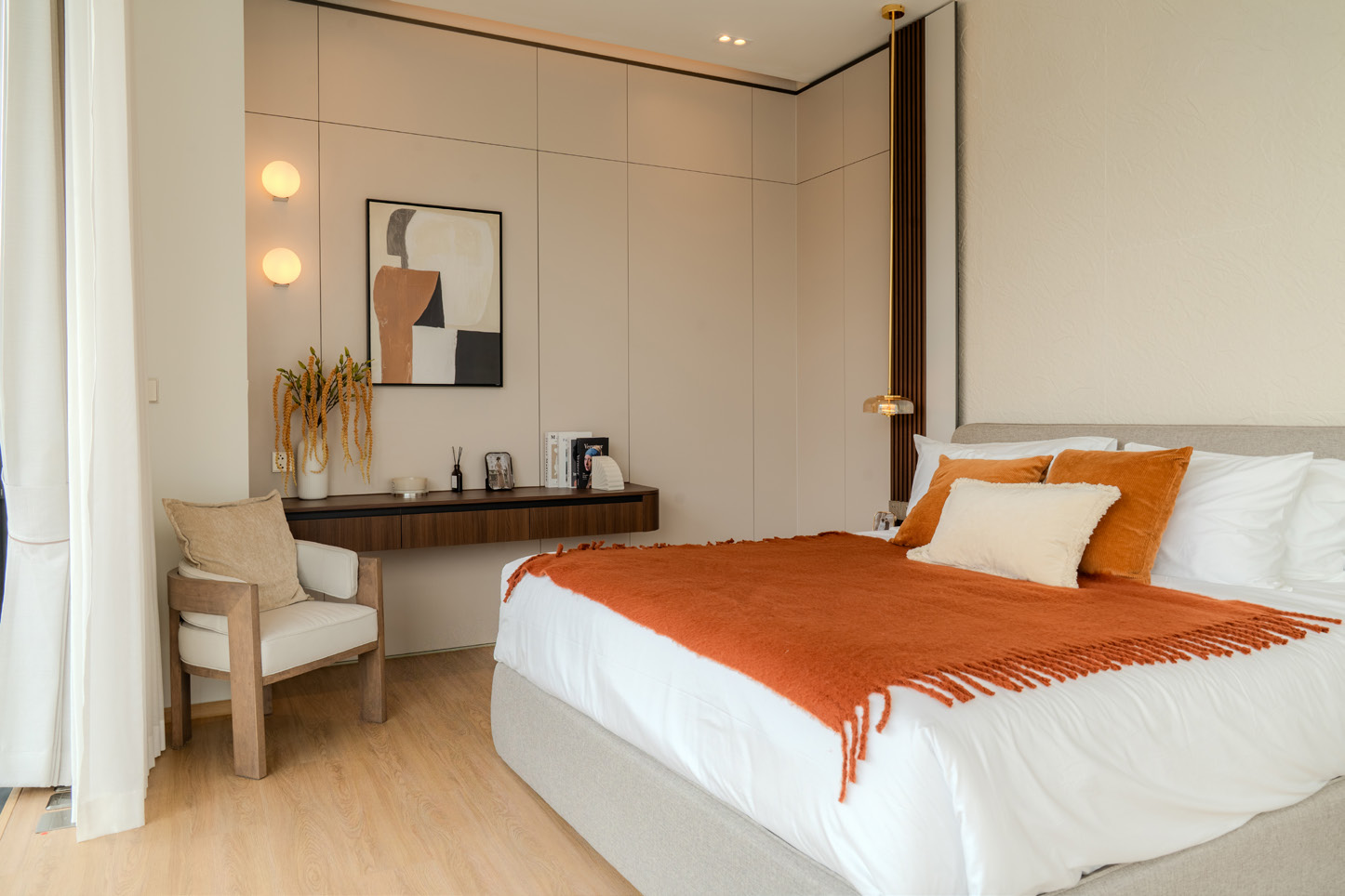 Master bedroom with warm textiles and a private reading nook